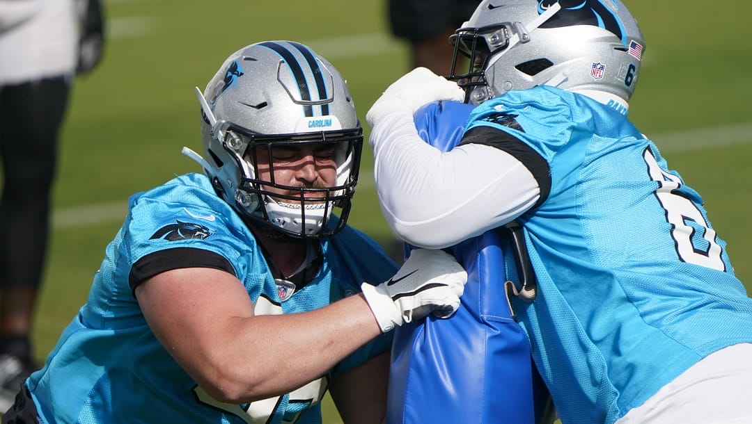 Carolina Panthers offensive tackles J.D. DiRenzo, left, and Ricky Lee (61) run a drill during NFL football practice, Thursday, June 1, 2023, in Charlotte, N.C.