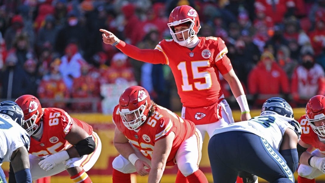 Kansas City Chiefs center Creed Humphrey (52) gets set to snap the ball, as quarterback Patrick Mahomes (15) calls out a play, during an NFL football game against the Seattle Seahawks Saturday, Dec. 24, 2022, in Kansas City, Mo. (AP Photo/Peter Aiken)