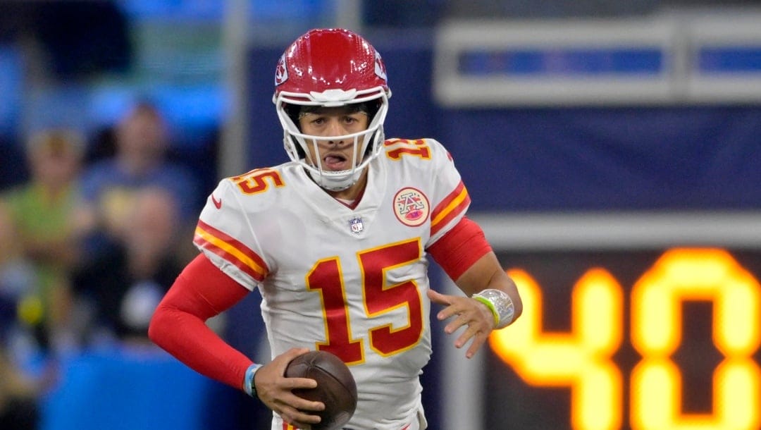 Kansas City Chiefs quarterback Patrick Mahomes scrambles in the pocket during an NFL football against the Los Angeles Chargers game Sunday, Nov. 20, 2022, in Inglewood, Calif. (AP Photo/Jayne Kamin-Oncea)