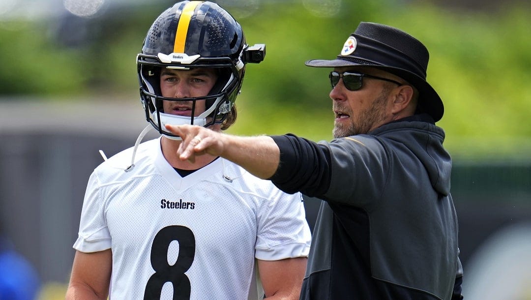 Pittsburgh Steelers quarterback Kenny Pickett, left, listens to offensive coordinator Matt Canada during the first day of the NFL football team's minicamp, in Pittsburgh on Tuesday, June 13, 2023.