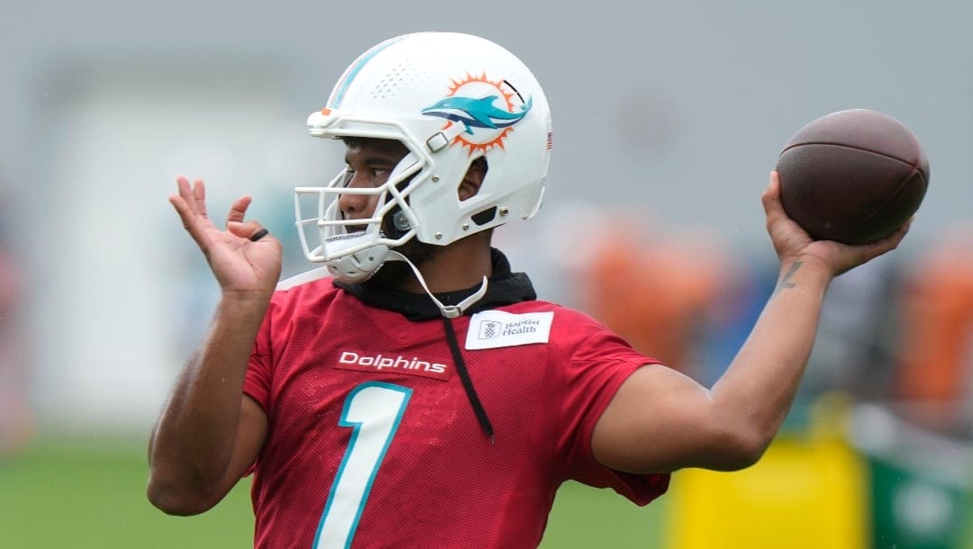 Miami Dolphins quarterback Tua Tagovailoa does drills during NFL football practice at the team's training facility, Tuesday, May 23, 2023, in Miami Gardens, Fla. (AP Photo/Lynne Sladky)
