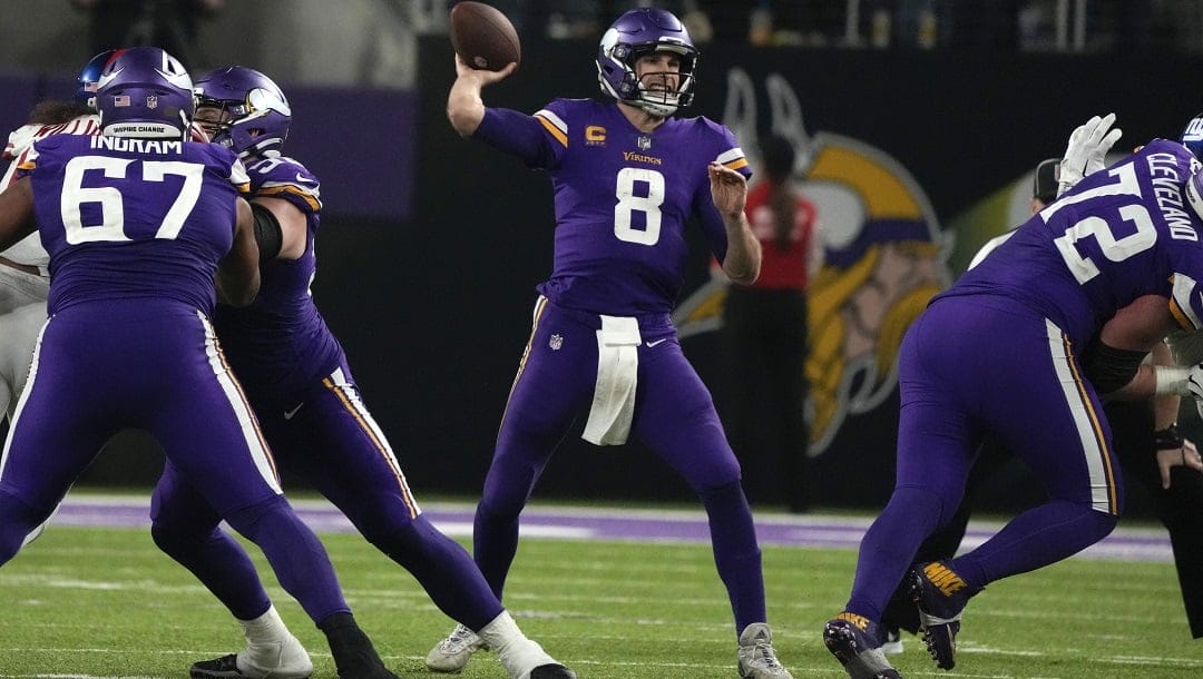 Minnesota Vikings quarterback Kirk Cousins (8) throws a pass during second half of an NFL wild card playoff football game against the New York Giants, Sunday, Jan. 15, 2023, in Minneapolis.