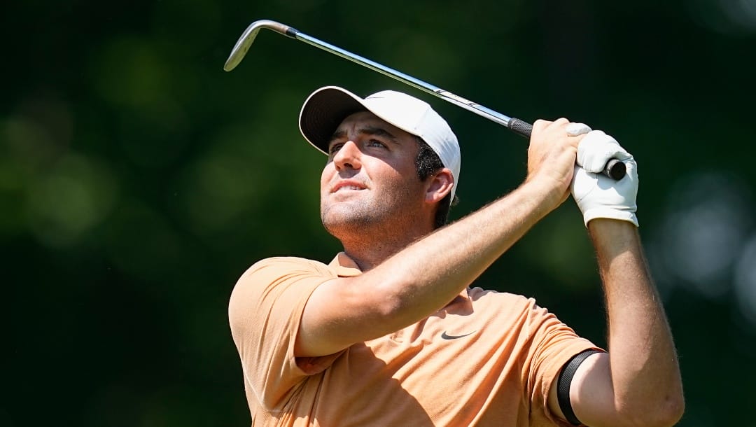 Scottie Scheffler watches his shot to the ninth green during the second round of the Memorial golf tournament, Friday, June 2, 2023, in Dublin, Ohio. (AP Photo/Darron Cummings)