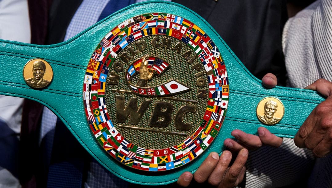 Mauricio Sulaiman, president of the World Boxing Council, holds up the "Cinturon Esmeralda" or Emerald Belt.