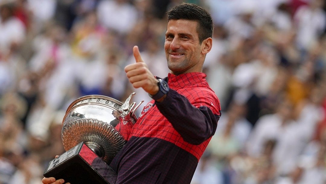 Serbia's Novak Djokovic celebrates winning the men's singles final match of the French Open tennis tournament against Norway's Casper Ruud in three sets, 7-6, (7-1), 6-3, 7-5, at the Roland Garros stadium in Paris, Sunday, June 11, 2023. Djokovic won his record 23rd Grand Slam singles title, breaking a tie with Rafael Nadal for the most by a man.