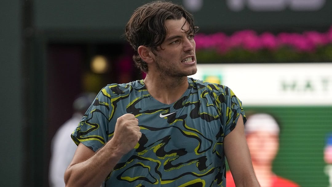 Taylor Fritz celebrates after defeating Marton Fucsovics, of Hungary, at the BNP Paribas Open tennis tournament Tuesday, March 14, 2023, in Indian Wells, Calif.