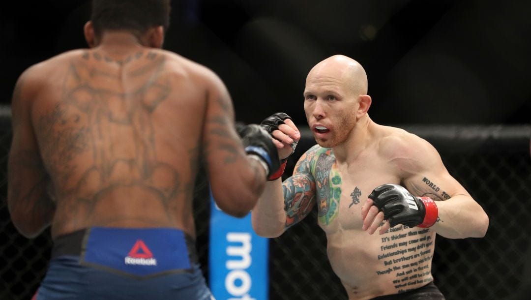 Josh Emmett, right, in action against Michael Johnson during their mixed martial arts bout at UFC Fight Night.