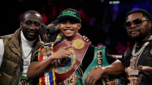 Shakur Stevenson, center, celebrates after defeating Oscar Valdez during a WBC-WBO junior lightweight title boxing bout.