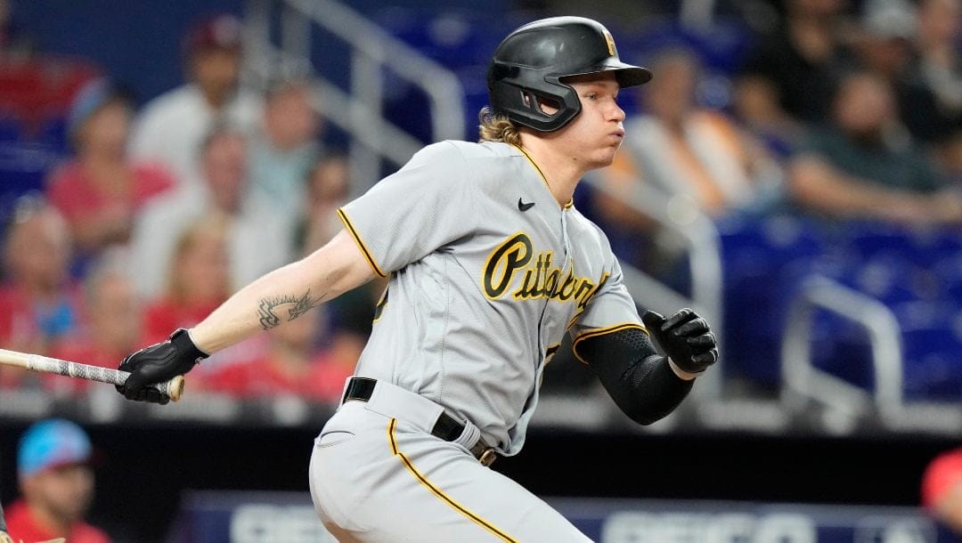 Pittsburgh Pirates' Jack Suwinski follows through on a single during the fourth inning of a baseball game against the Miami Marlins, Saturday, June 24, 2023, in Miami.