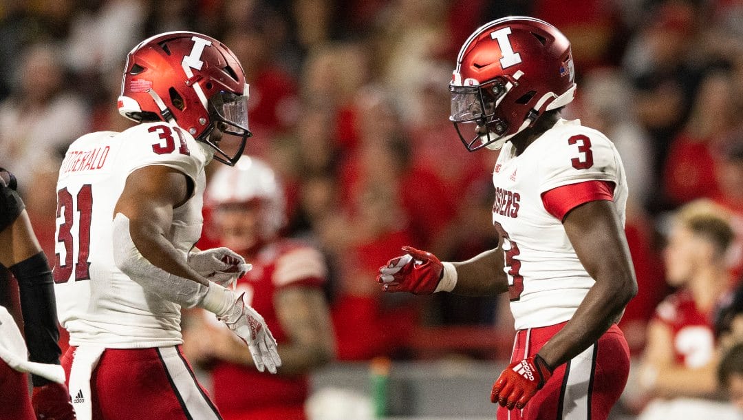 Indiana defensive backs Bryant Fitzgerald (31) and Tiawan Mullen (3) celebrate a play against Nebraska during the second half of an NCAA college football game Saturday, Oct. 1, 2022, in Lincoln, Neb. Nebraska defeated Indiana 35-21.