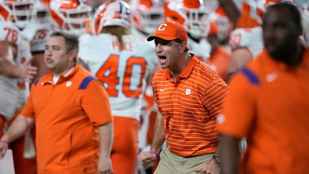 Clemson coach Dabo Swinney encourages players before the team's Orange Bowl NCAA college football game against Tennessee, Friday, Dec. 30, 2022, in Miami Gardens, Fla.
