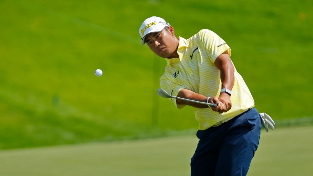 Hideki Matsuyama hits onto the 16th green during the fourth round at the 3M Open golf tournament at the Tournament Players Club, Sunday, July 30, 2023, in Blaine, Minn.