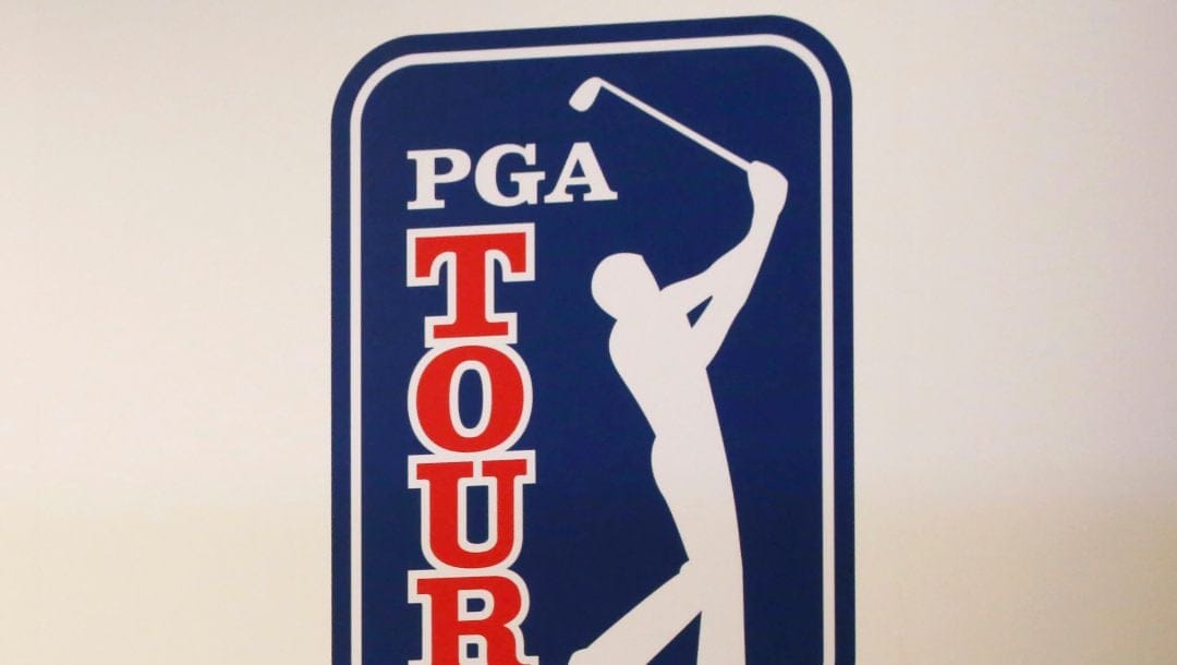 The PGA Tour logo is shown during a press conference in Tokyo, Nov. 20, 2018. The most disruptive year in golf ended Tuesday, June 6, 2023, when the PGA Tour and European tour agreed to a merger with Saudi Arabia's golf interests, creating a commercial operation designed to unify professional golf around the world.