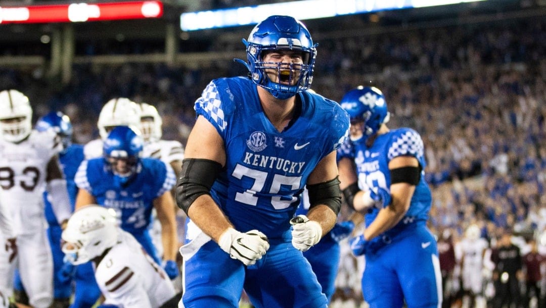Kentucky offensive lineman Eli Cox (75) celebrates after a touchdown scored by running back Chris Rodriguez Jr. against Mississippi State during the second half of an NCAA college football game in Lexington, Ky., Saturday, Oct. 15, 2022. (AP Photo/Michael Clubb)