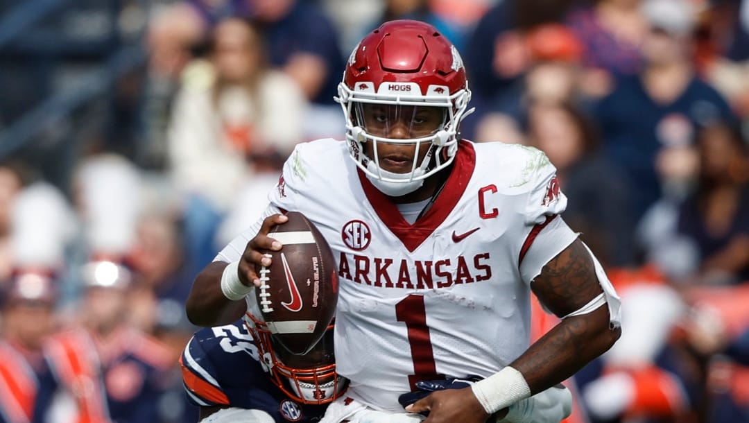 Arkansas quarterback KJ Jefferson (1) is sacked by Auburn defensive end Colby Wooden (25) during the first half of an NCAA college football game Saturday, Oct. 29, 2022, in Auburn, Ala. (AP Photo/Butch Dill)