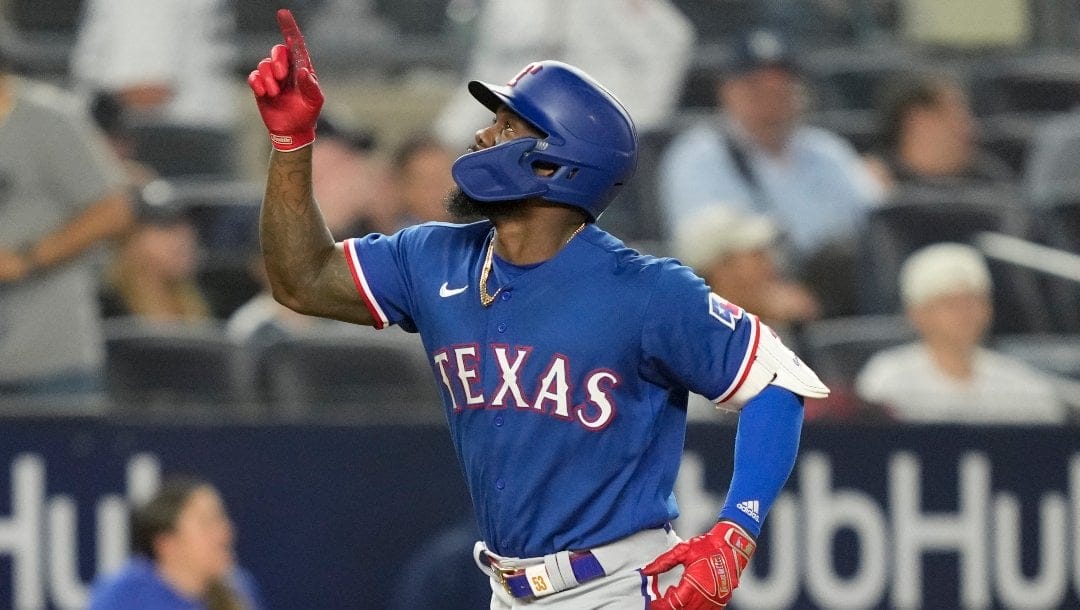 Texas Rangers' Adolis Garcia celebrates as he runs the bases after hitting a go-ahead, two-run home run off New York Yankees relief pitcher Michael King during the 10th inning of a baseball game Friday, June 23, 2023, in New York.