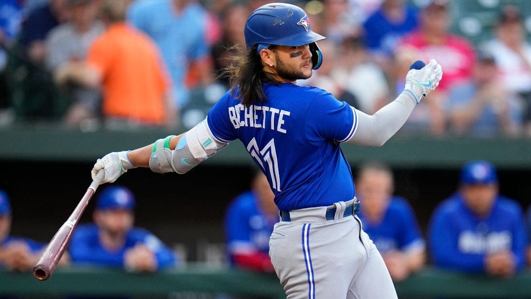Toronto Blue Jays' Bo Bichette swings at a pitch from the Baltimore Orioles during the first inning of a baseball game, Wednesday, June 14, 2023, in Baltimore.