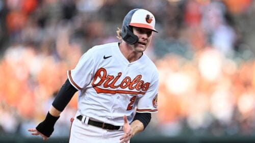 Baltimore Orioles' Gunnar Henderson races to third on a double by Anthony Santander against the New York Yankees in the first inning of a baseball game Sunday, July 30, 2023, in Baltimore.