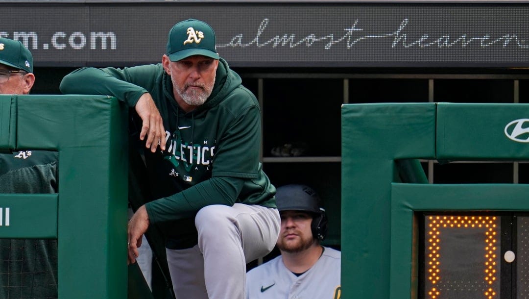 Oakland Athletics manager Mark Kotsay stands on the dugout steps during a baseball game against the Pittsburgh Pirates in Pittsburgh, Tuesday, June 6, 2023. (AP Photo/Gene J. Puskar)