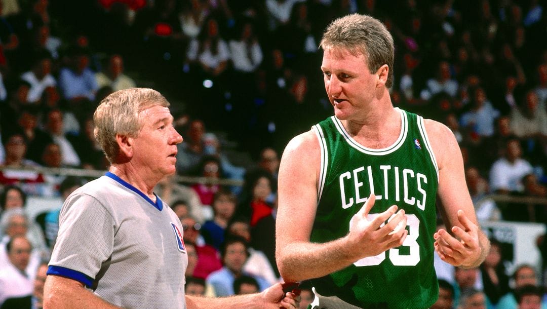 Larry Bird #33 of the Boston Celtics talks with referee against the Golden State Warriors during a game in 1991.