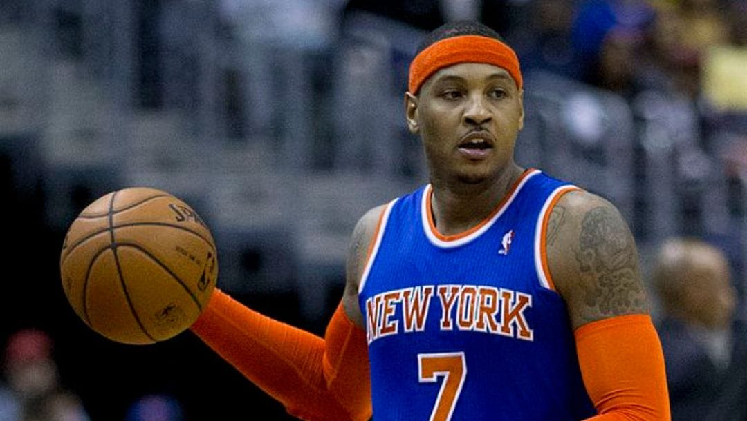 Carmelo Anthony dribbles the ball in an NBA game against the Washington Wizards in November 2013.