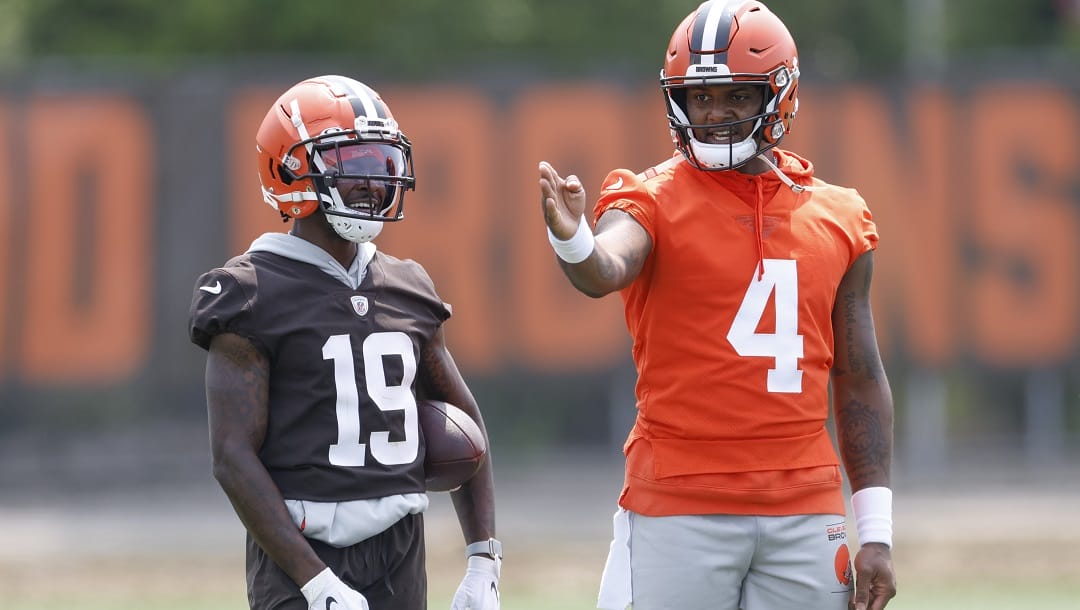 Cleveland Browns quarterback Deshaun Watson (4) talks with wide receiver Marquise Goodwin (19) during a drill at the NFL football team's practice facility Wednesday, June 7, 2023, in Berea, Ohio.