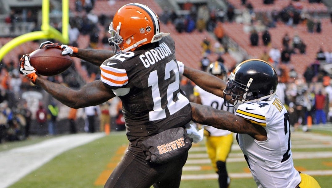 Cleveland Browns wide receiver Josh Gordon (12) catches a 1-yard touchdown pass against Pittsburgh Steelers cornerback Ike Taylor in the fourth quarter of an NFL football game Sunday, Nov. 24, 2013.