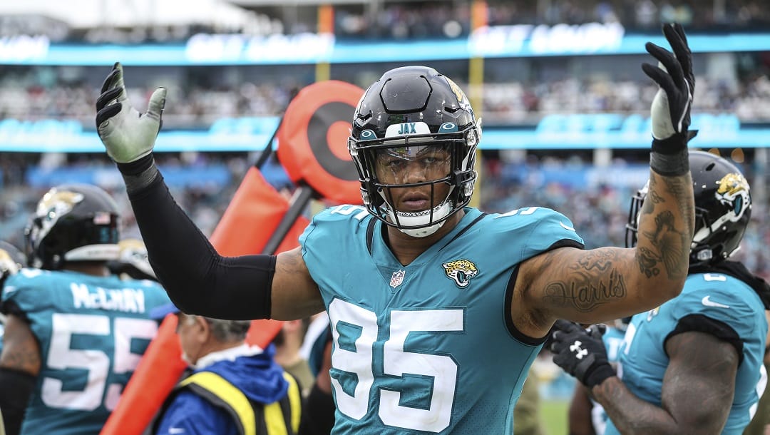 Jacksonville Jaguars defensive end Roy Robertson-Harris (95) hypes up the fans during the second half of an NFL football game against the Atlanta Falcons, Sunday, Nov. 28, 2021, in Jacksonville, Fla. The Falcons defeated the Jaguars 21-14.