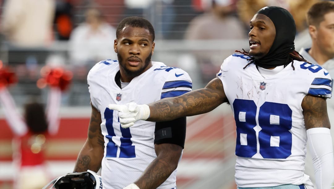 Dallas Cowboys linebacker Micah Parsons (11) and wide receiver CeeDee Lamb (88) walk off the field after the first half of an NFL divisional round playoff football game against the San Francisco 49ers in Santa Clara, Calif., Sunday, Jan. 22, 2023. (AP Photo/Josie Lepe)