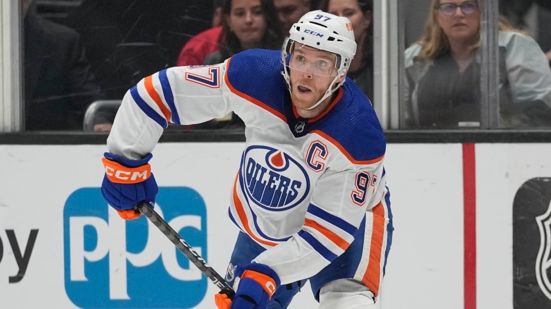 Edmonton Oilers center Connor McDavid (97) passes the puck during Game 4 of an NHL hockey Stanley Cup first-round playoff series hockey game against the Los Angeles Kings Sunday, April 23, 2023, in Los Angeles.