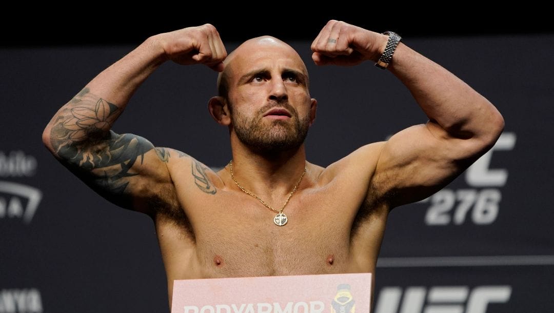 Alexander Volkanovski poses during a ceremonial weigh-in for the UFC 276 mixed martial arts event, Friday, July 1, 2022.
