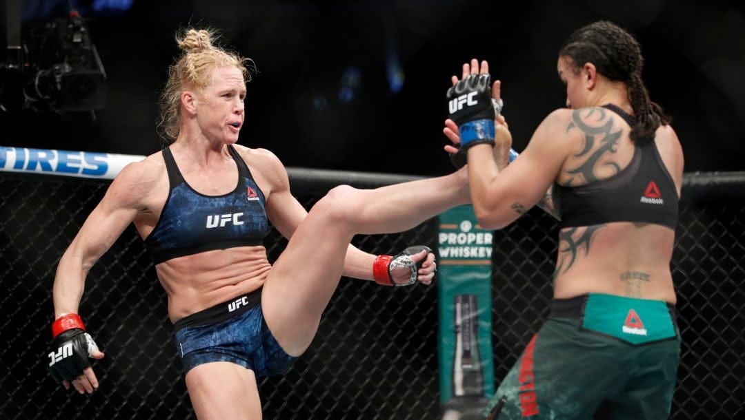 Holly Holm kicks Raquel Pennington during a UFC 246 women's bantamweight mixed martial arts bout Saturday, Jan. 18, 2020.