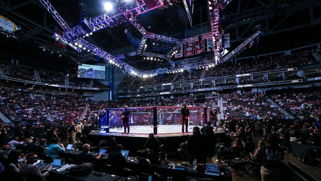 Fans await the next fight during a UFC 261 mixed martial arts event, Saturday, April 24, 2021, in Jacksonville, Fla.