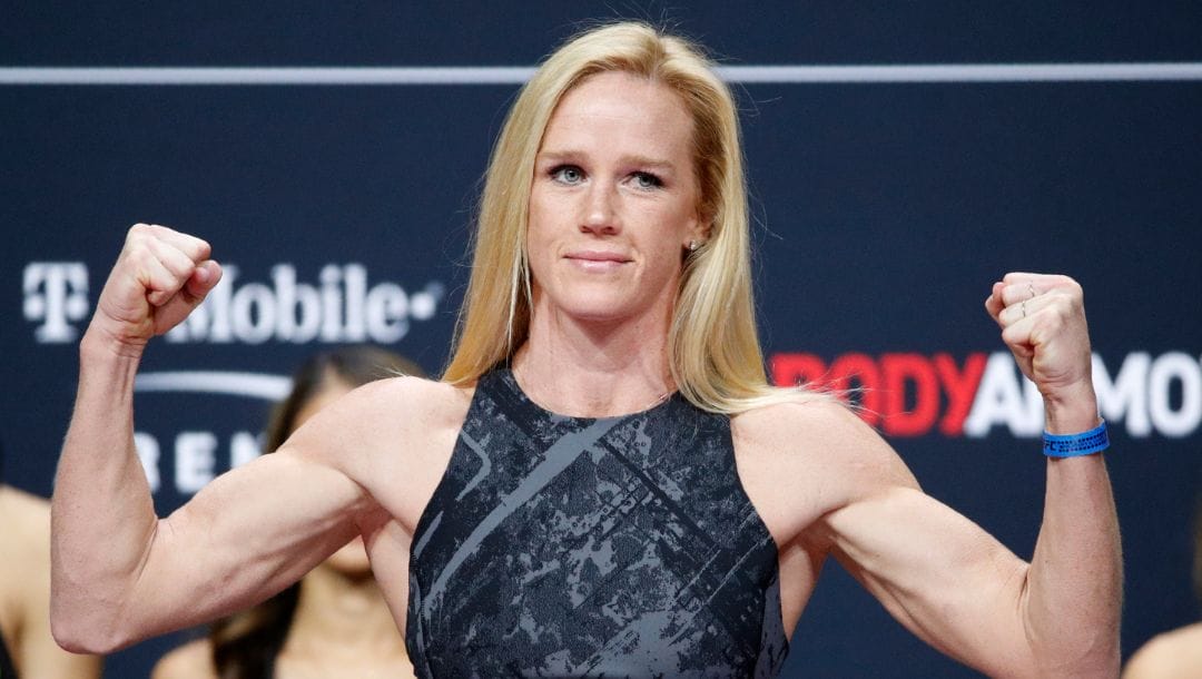 Holly Holm poses during a ceremonial weigh-in for the UFC 246 mixed martial arts bout, Friday, Jan. 17, 2020, in Las Vegas.