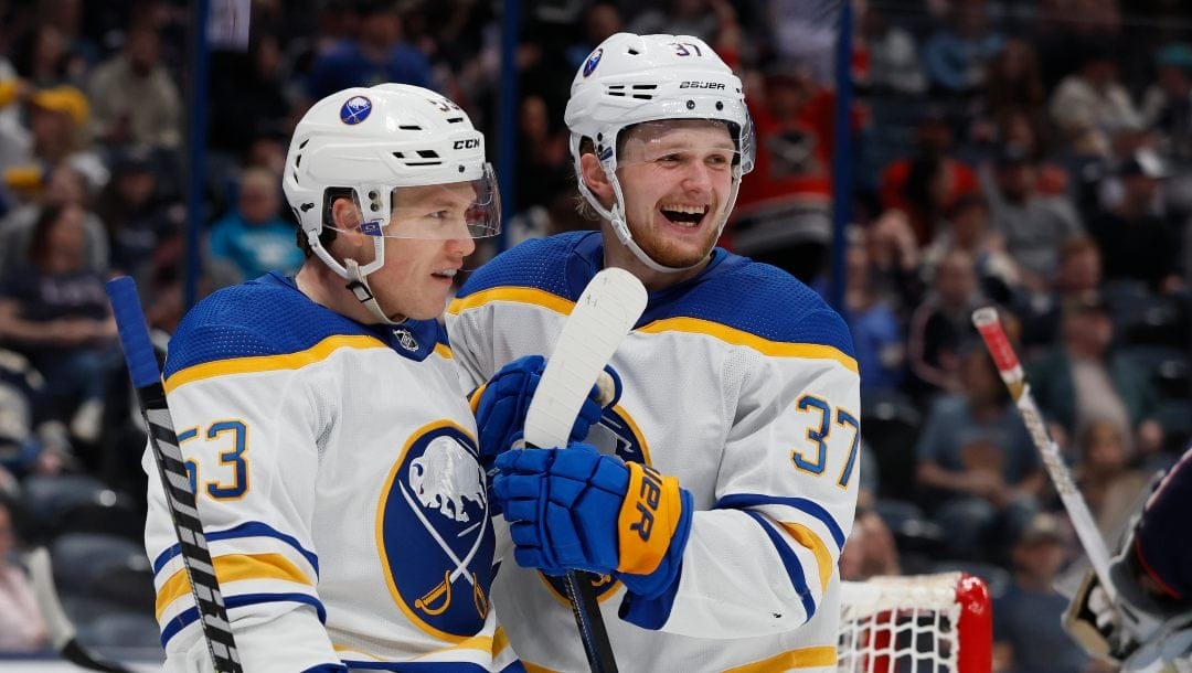 Buffalo Sabres' Casey Mittelstadt, right, celebrates after his goal against the Columbus Blue Jackets with teammate Jeff Skinner during the third period of an NHL hockey game Friday, April 14, 2023, in Columbus, Ohio.