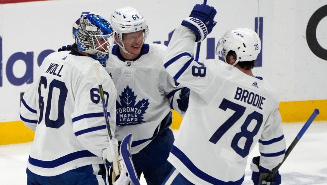 Toronto Maple Leafs goaltender Joseph Woll (60) celebrates with center David Kampf (64) and defenseman TJ Brodie (78) after the team's over the Florida Panthers in Game 4 of an NHL hockey Stanley Cup second-round playoff series Wednesday, May 10, 2023, in Sunrise, Fla.
