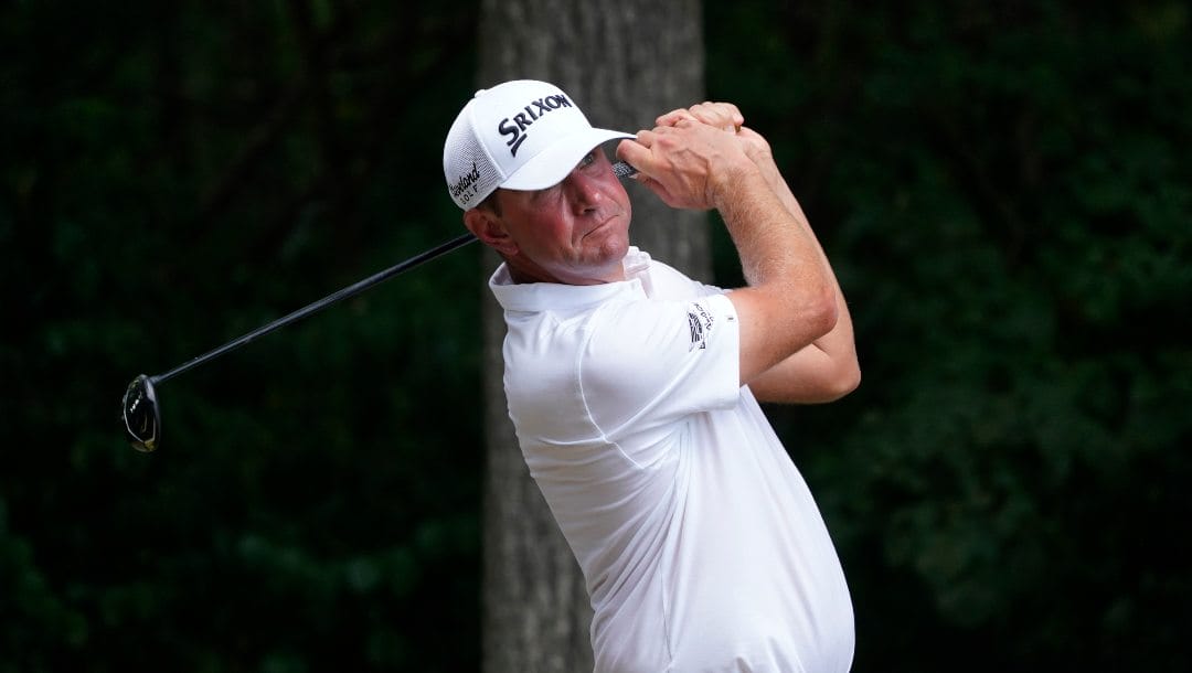 Lucas Glover watches his tee shot on the second hole during the final round of the Wyndham Championship golf tournament in Greensboro, N.C., Sunday, Aug. 6, 2023.