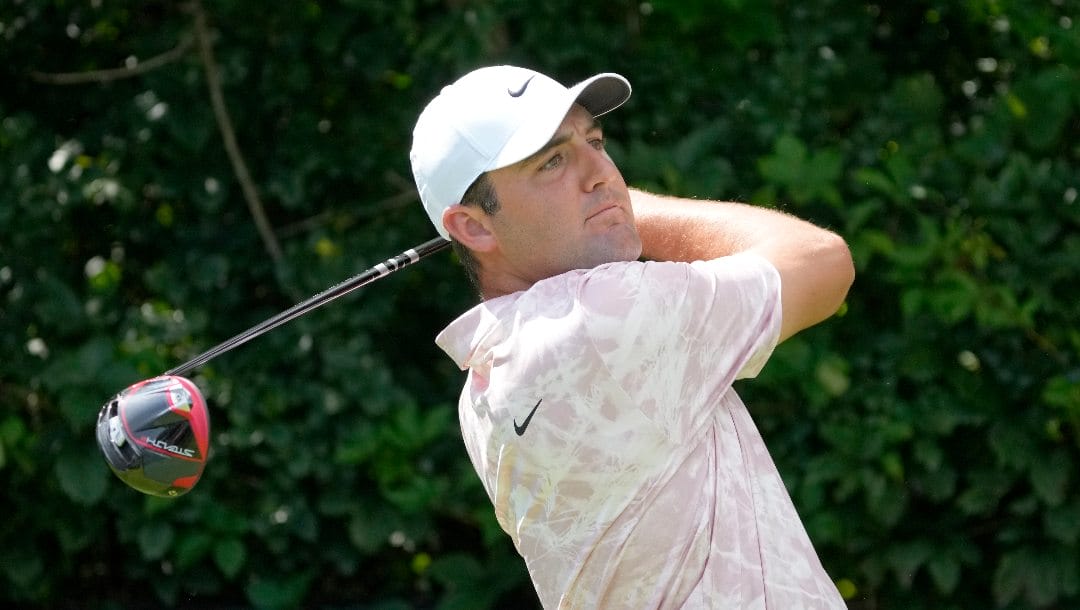 Scottie Scheffler watches is tee shot on the second hole during the first round of the BMW Championship golf tournament, Thursday, Aug. 17, 2023, in Olympia Fields, Ill.