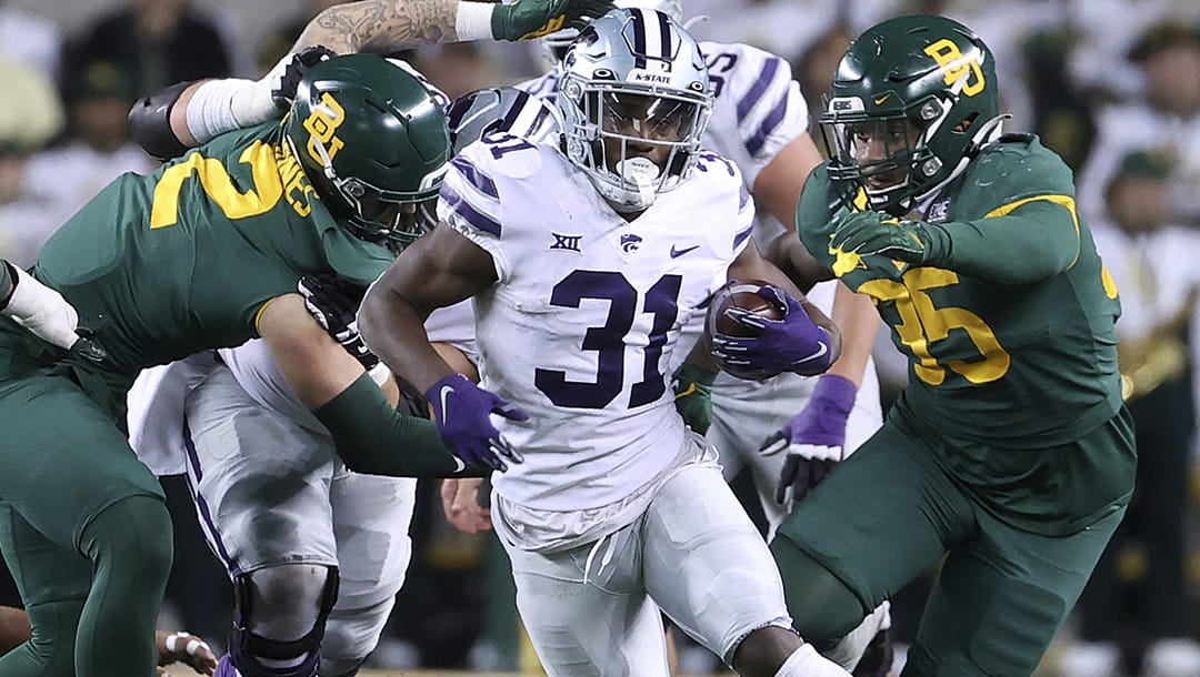 Kansas State running back DJ Giddens (31) runs between Baylor linebackers Matt Jones (2) and Jackie Marshall (35) in the second half of an NCAA college football game, Saturday, Nov. 12, 2022, in Waco, Texas. Kansas State opens their season at home against Southeast Missouri State on Sept. 2.