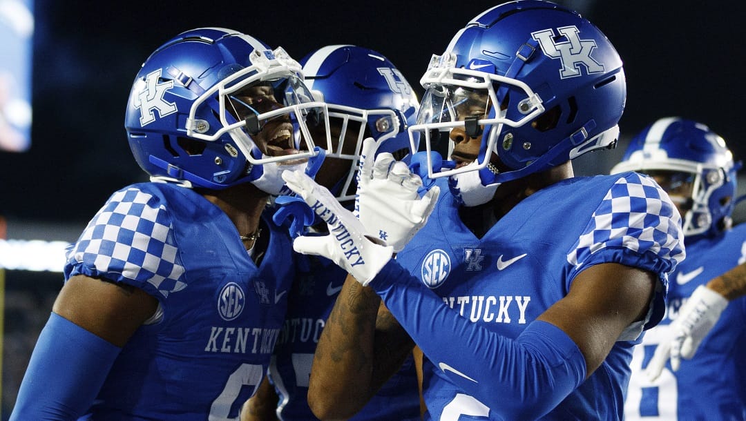 Kentucky wide receiver Tayvion Robinson (9) celebrates with wide receiver Barion Brown (2) after scoring a touchdown against Northern Illinois during the second half of an NCAA college football game in Lexington, Ky., Saturday, Sept. 24, 2022.
