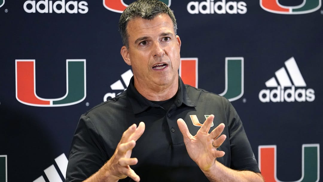 Miami head coach Mario Cristobal talks with the media at the team's NCAA college football media day, Tuesday, Aug. 2, 2022, in Coral Gables, Fla. Cristobal isn't the only coach who came home to Miami. The Hurricanes have no shortage of assistants and analysts with deep Miami ties who signed on to join Cristobal's first staff at his alma mater.