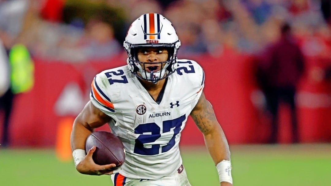 Auburn running back Jarquez Hunter (27) carries the ball against Alabama during the second half of an NCAA college football game Saturday, Nov. 26, 2022, in Tuscaloosa, Ala. (AP Photo/Butch Dill)