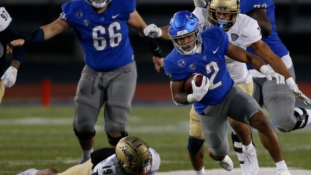Buffalo Bulls running back Ron Cook Jr. gets past Akron Zips safety MyJaden Horton (19) during the second half of an NCAA college football game at UB stadium in Amherst, N.Y., Saturday Dec. 12, 2020. (AP/ Photo Jeffrey T. Barnes)