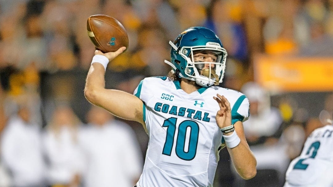 FILE - Coastal Carolina quarterback Grayson McCall (10) throws a pass during the first half of the team's NCAA college football game against Appalachian State on Oct. 20, 2021, in Boone, N.C. Three-time Sun Belt Conference player of the year McCall said Monday, Dec. 12, 2022, that he's entering the NCAA transfer portal to “explore other opportunities.” (AP Photo/Matt Kelley, File)