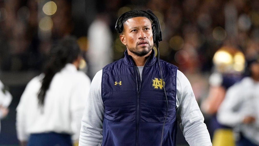 Notre Dame head coach Marcus Freeman looks at the scoreboard during the first half of the team's NCAA college football game against Stanford in South Bend, Ind., Saturday, Oct. 15, 2022.