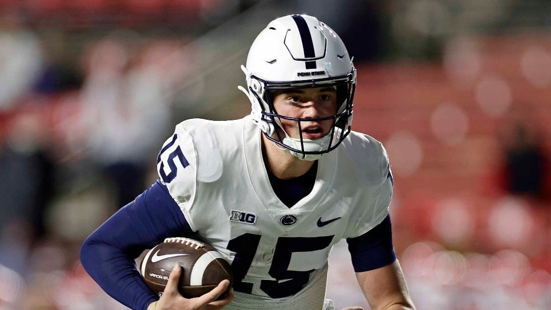 Penn State quarterback Drew Allar (15) runs with the ball against Rutgers during the second half of an NCAA college football game Saturday, Nov. 19, 2022, in Piscataway, N.J. Penn State won 55-10. (AP Photo/Adam Hunger)