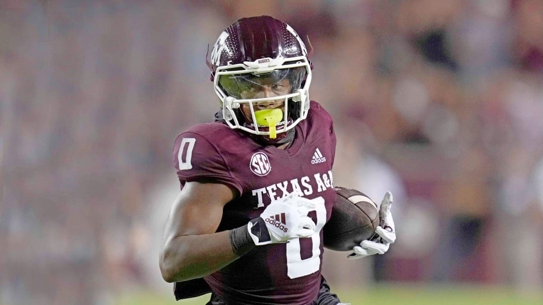 Texas A&M wide receiver Ainias Smith (0) looks to run after a catch against Miami during the second half of an NCAA college football game Saturday, Sept. 17, 2022, in College Station, Texas. (AP Photo/Sam Craft)