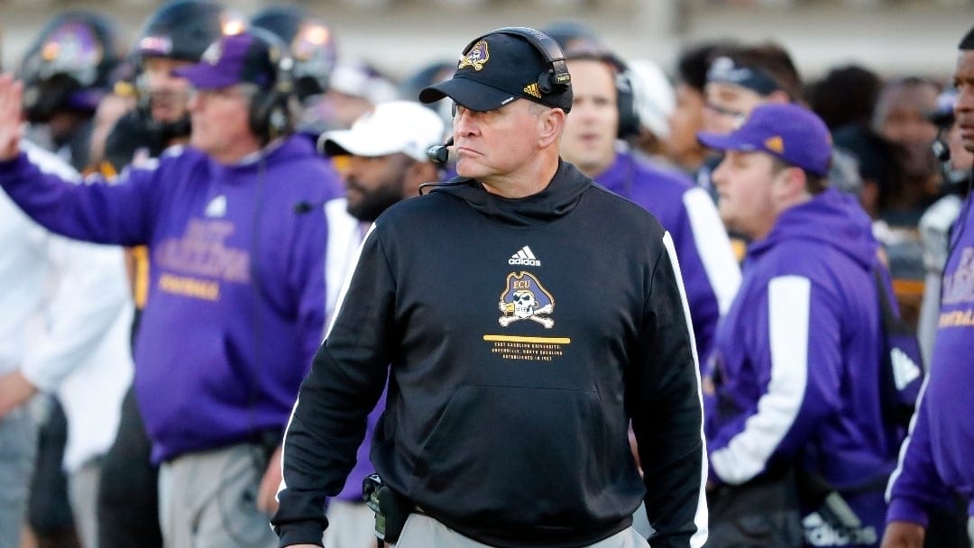 FILE - East Carolina head coach Mike Houston watches from the sideline during the first half of an NCAA college football game against Cincinnati in Greenville, N.C., Friday, Nov. 26, 2021. East Carolina will host No. 13 North Carolina State on Saturday to open the season.