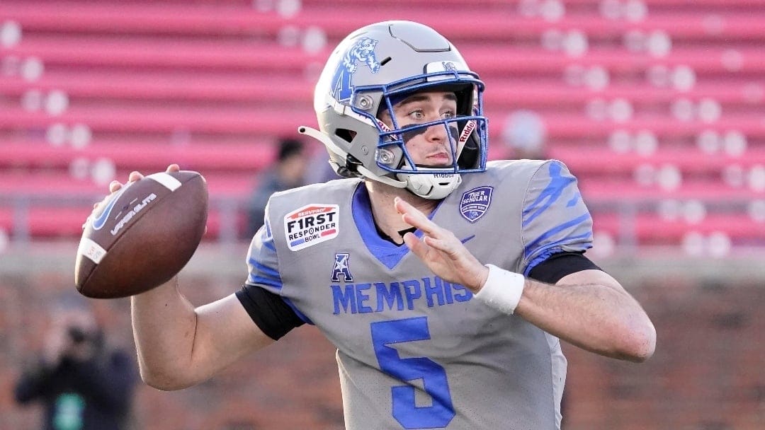 Memphis quarterback Seth Henigan (5) looks to pass during the second half of the First Responder Bowl NCAA college football game against Utah State, Tuesday, Dec. 27, 2022, in Dallas. (AP Photo/Sam Hodde)