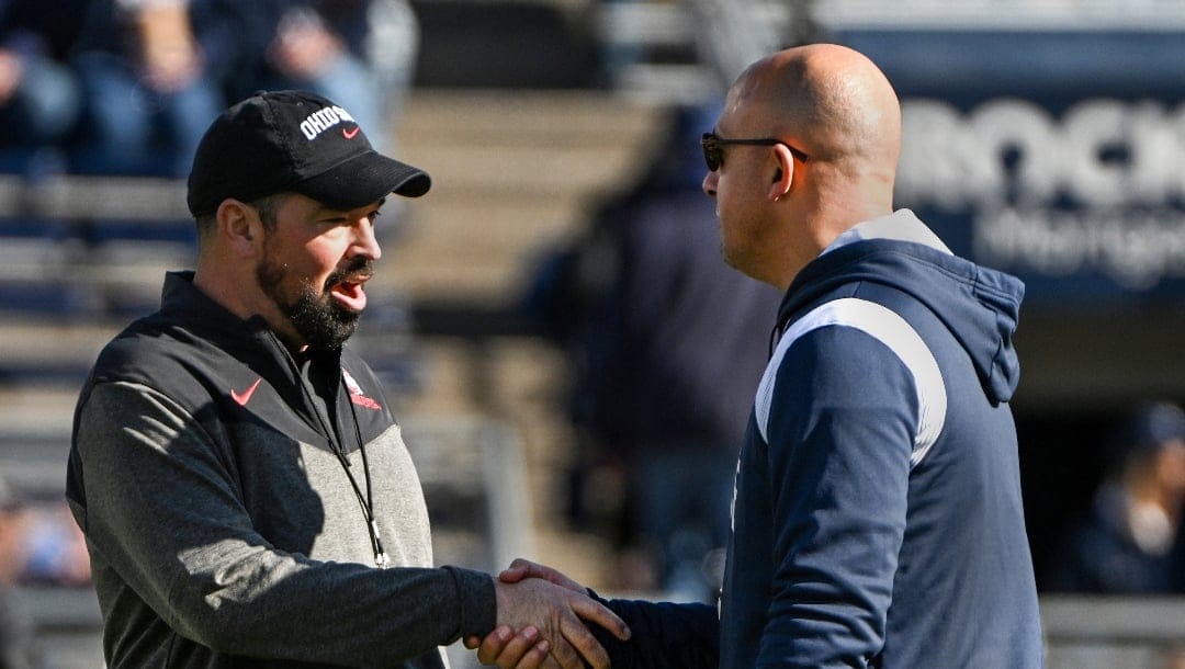 Ohio State head coach Ryan Day greets Penn State head coach James Franklin before an NCAA college football game, Saturday, Oct. 29, 2022, in State College, Pa. (AP Photo/Barry Reeger)